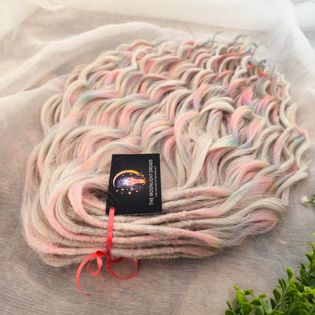Fairy Dust - 50 DE soft, lightweight, and reusable synthetic standard dreaded brushable curls. A mix of platinum blonde and pastel rainbow/prism