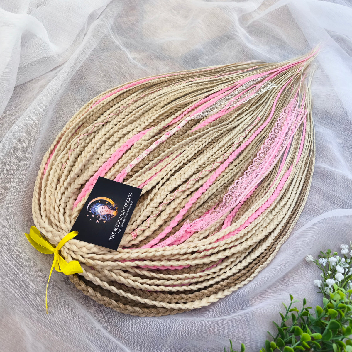 Vanilla Rose - a soft, lightweight, and reusable set of DE synthetic braids in creamy vanilla blonde, beige, and soft pink shades