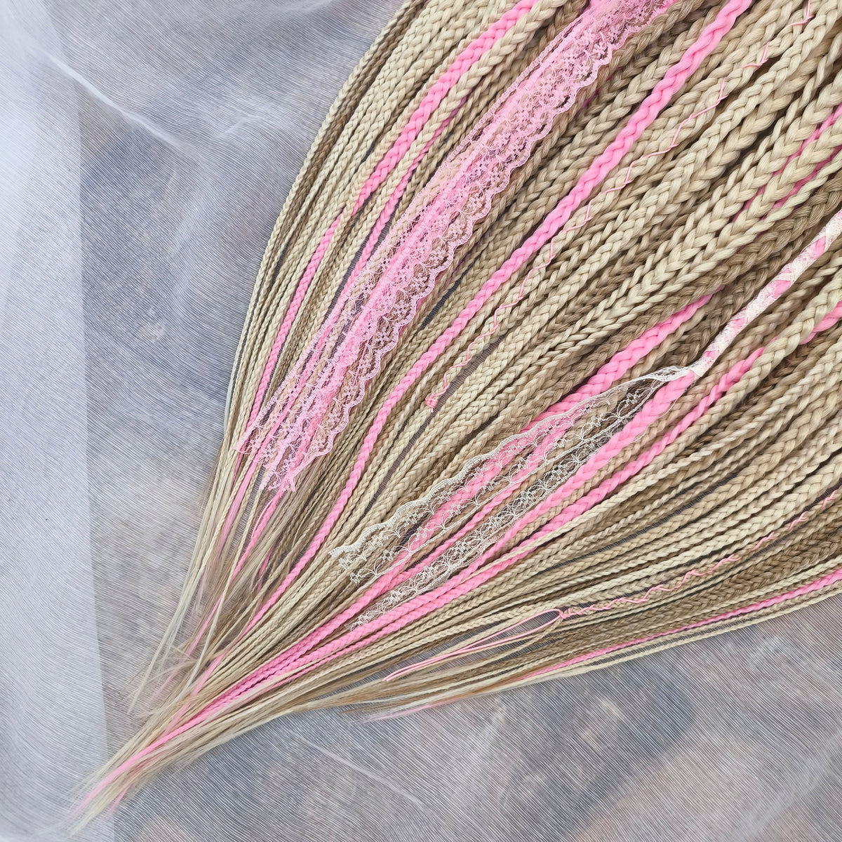 Vanilla Rose - a soft, lightweight, and reusable set of DE synthetic braids in creamy vanilla blonde, beige, and soft pink shades