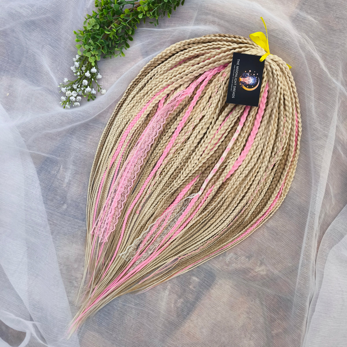 Vanilla Rose - a soft, lightweight, and reusable set of DE synthetic braids in creamy vanilla blonde, beige, and soft pink shades
