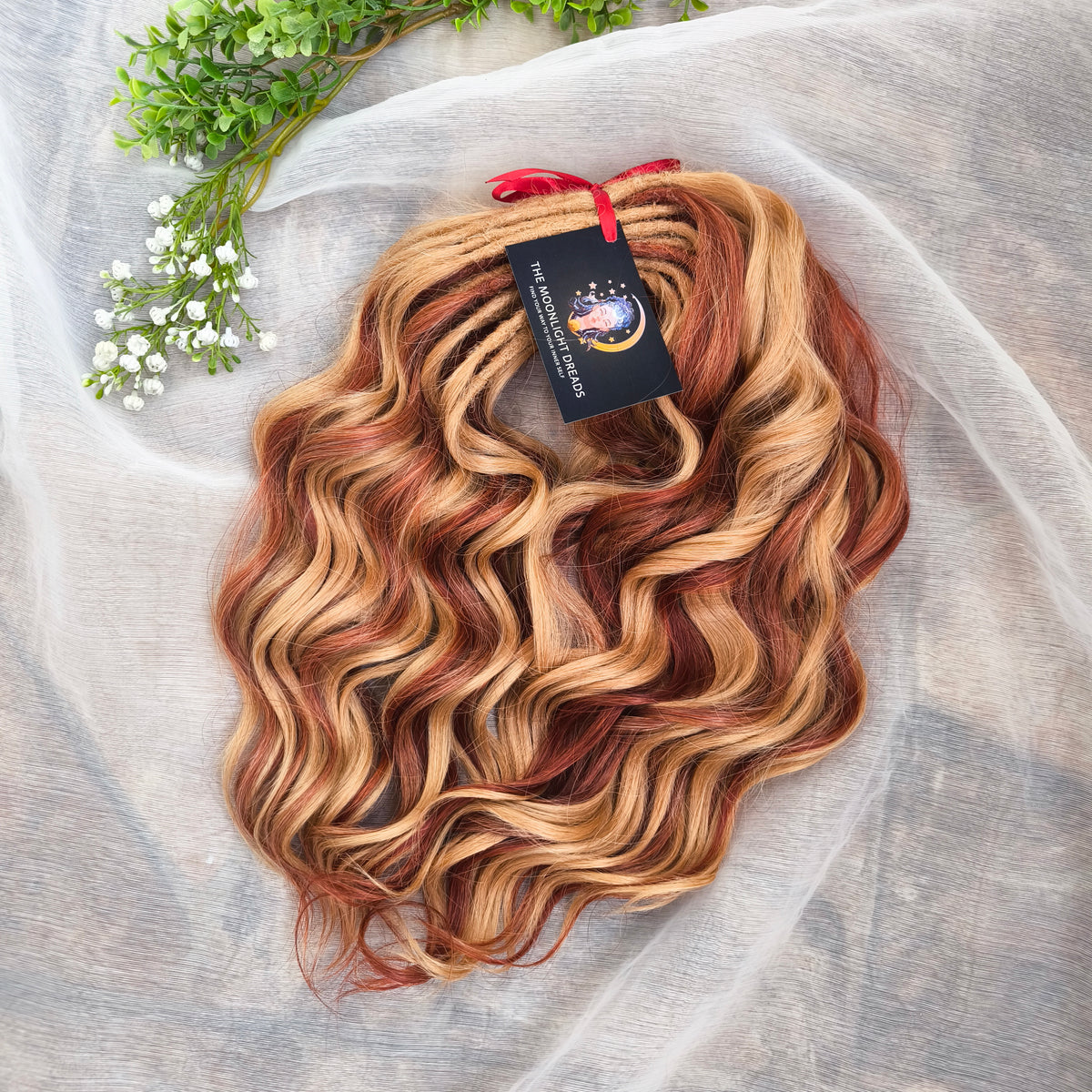 Copper Honey - 60 DE soft, lightweight, and reusable synthetic standard dreaded brushable curls Manasi. Peach blonde base mixed with copper red.