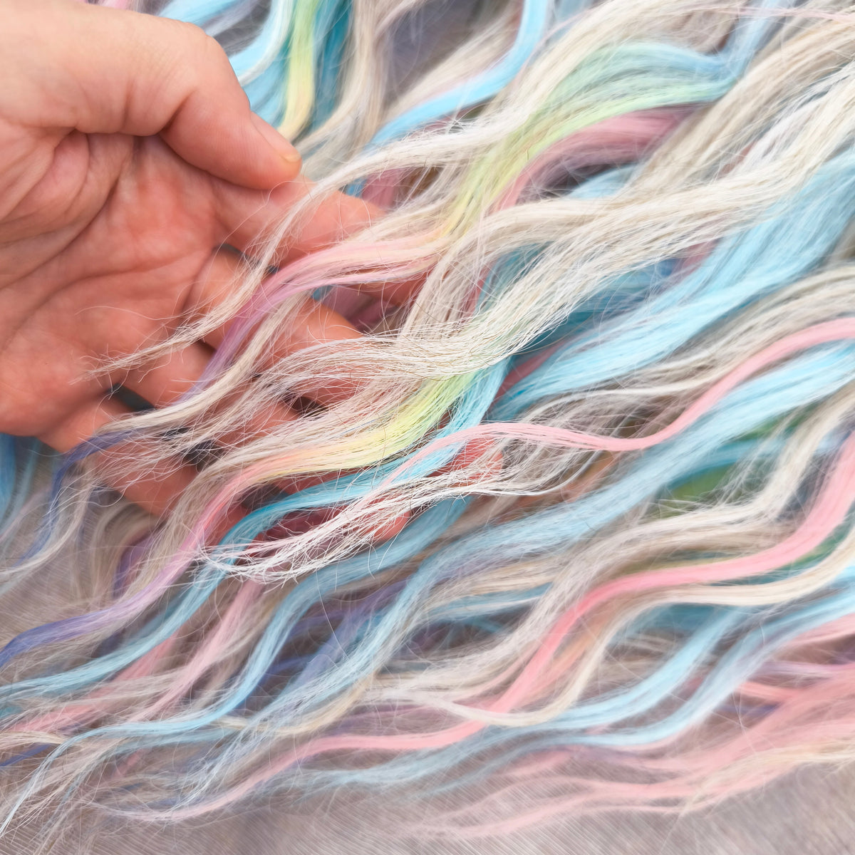 Second Life: Cotton Candy - 50 DE synthetic regular dreaded brushable curls (one-side dreaded part). A blend of platinum blonde, sky blue, pink, and rainbow colors.  Worn once . Has been washed and corrected. Good condition (a bit damaged ends).