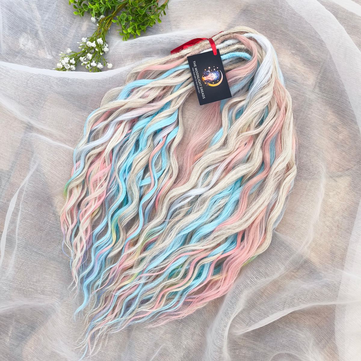 Second Life: Cotton Candy - 50 DE synthetic regular dreaded brushable curls (one-side dreaded part). A blend of platinum blonde, sky blue, pink, and rainbow colors.  Worn once . Has been washed and corrected. Good condition (a bit damaged ends).