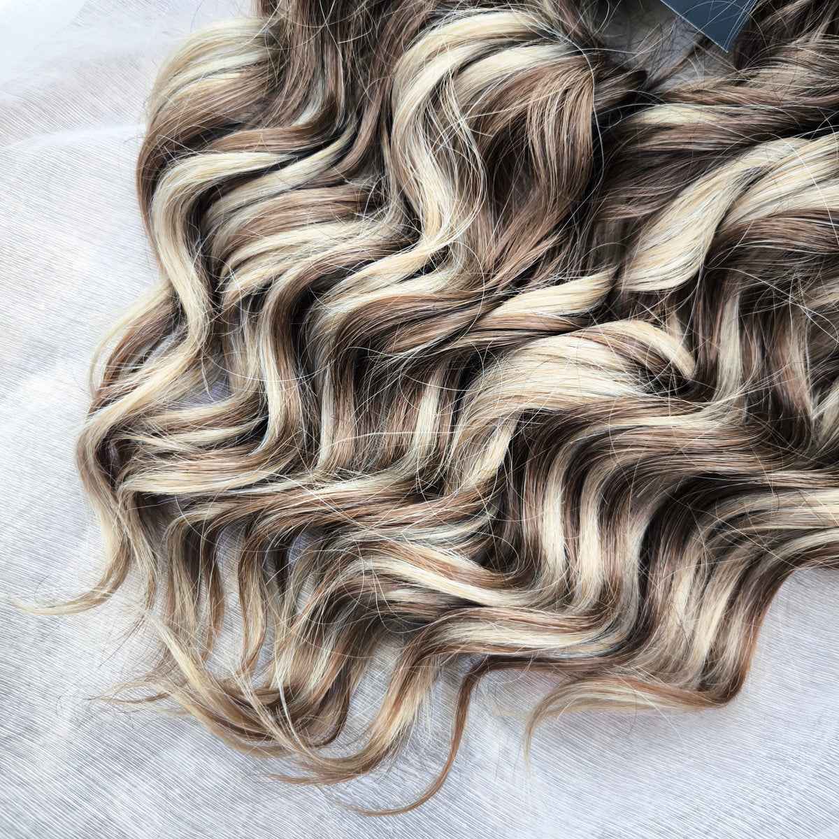 Ash Browny - 60 DE soft, lightweight, and reusable synthetic standard dreaded brushable curls Manasi. A mix of ash wheat blonde with dark chocolate brown roots and brown