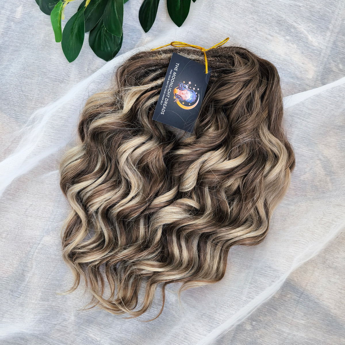 Ash Browny - 60 DE soft, lightweight, and reusable synthetic standard dreaded brushable curls Manasi. A mix of ash wheat blonde with dark chocolate brown roots and brown