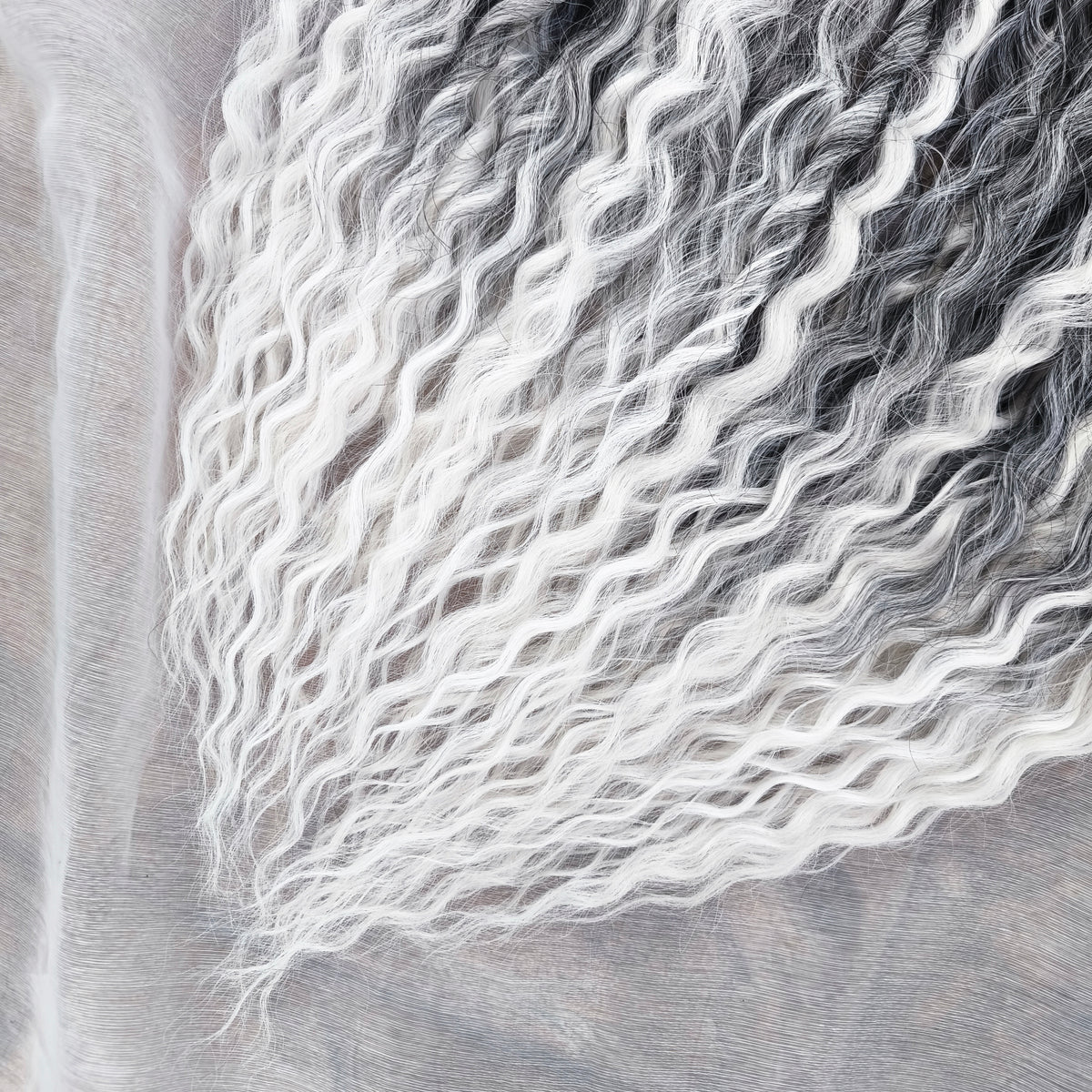 mix of ombre from grey to white and snow white, lightweight, and reusable double ended synthetic standard dreaded non-brushable curls