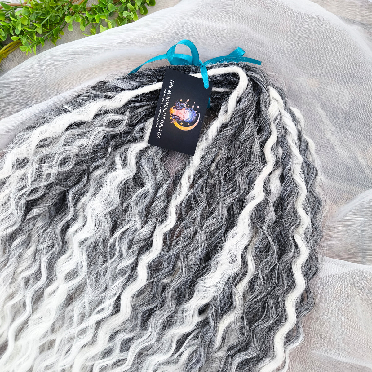 mix of ombre from grey to white and snow white, lightweight, and reusable double ended synthetic standard dreaded non-brushable curls