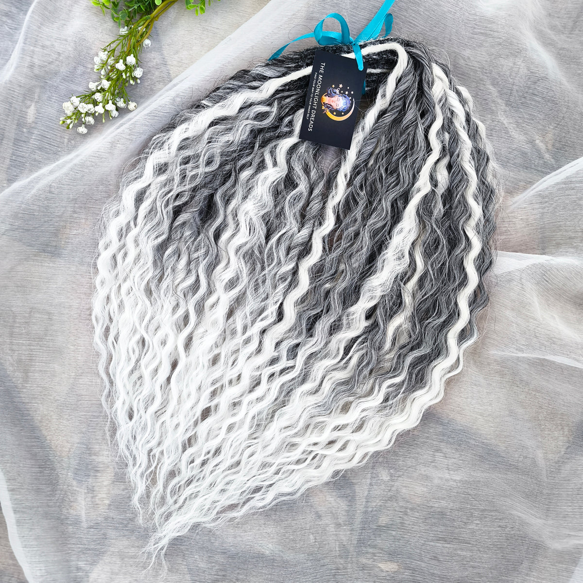 mix of ombre from grey to white and snow white, lightweight, and reusable double ended synthetic standard dreaded non-brushable curls