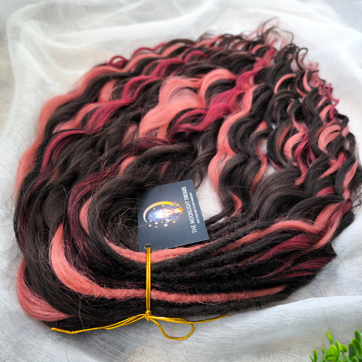 Rosewood - a soft, lightweight, and reusable set of double ended wavy dreadlocks in dark chocolate brown, dusty rose pink, and bordo shades. A rich, warm blend with a subtle romantic touch.