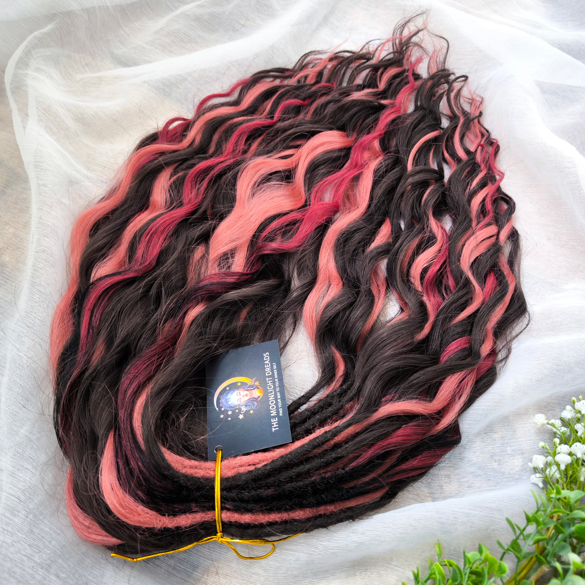 Rosewood - a soft, lightweight, and reusable set of double ended wavy dreadlocks in dark chocolate brown, dusty rose pink, and bordo shades. A rich, warm blend with a subtle romantic touch.