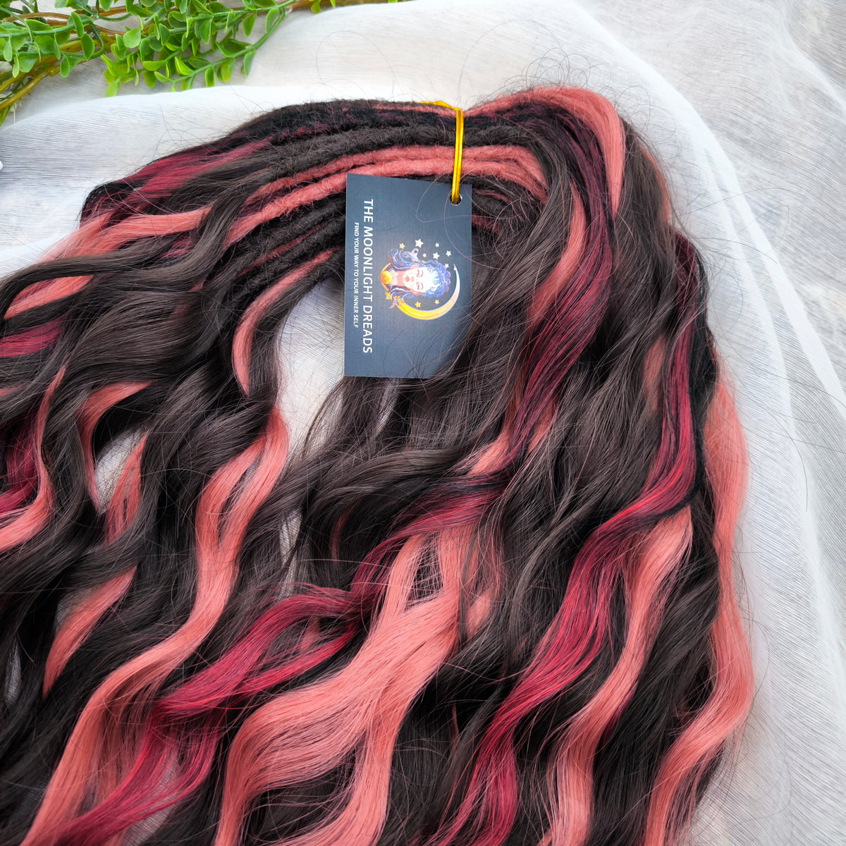Rosewood - a soft, lightweight, and reusable set of double ended wavy dreadlocks in dark chocolate brown, dusty rose pink, and bordo shades. A rich, warm blend with a subtle romantic touch.