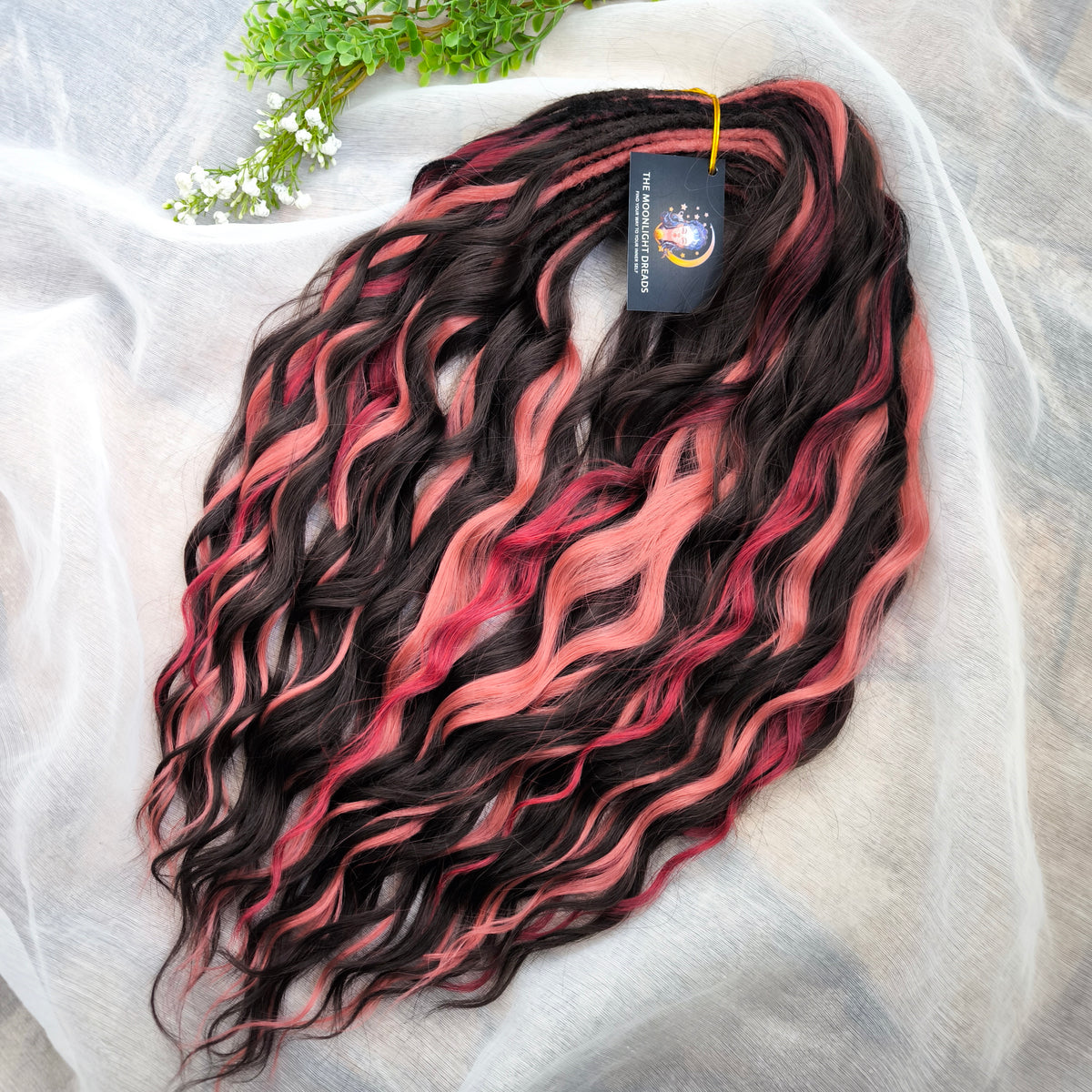 Rosewood - a soft, lightweight, and reusable set of double ended wavy dreadlocks in dark chocolate brown, dusty rose pink, and bordo shades. A rich, warm blend with a subtle romantic touch.