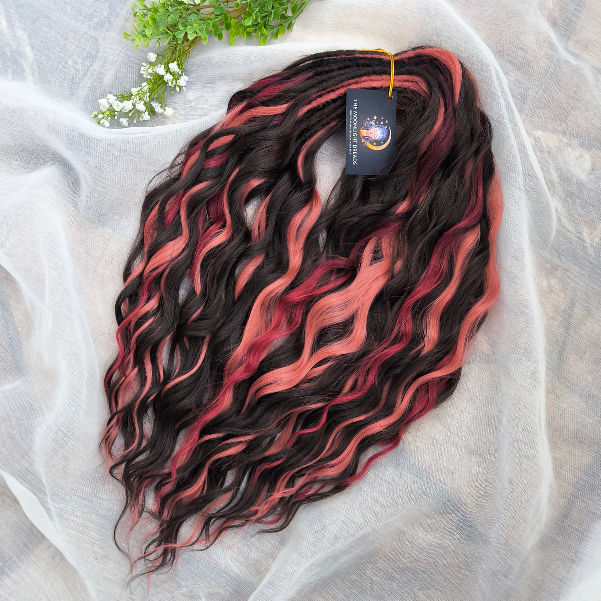 Rosewood - a soft, lightweight, and reusable set of double ended wavy dreadlocks in dark chocolate brown, dusty rose pink, and bordo shades. A rich, warm blend with a subtle romantic touch.