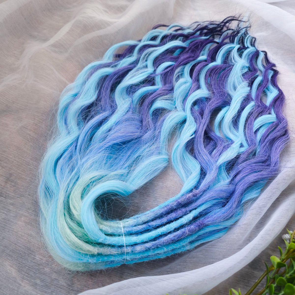 Blue Iris - soft, lightweight, and reusable; this set combines purple, cool blue, and deep navy brushable, synthetic double ended wavy dreadlocks.
