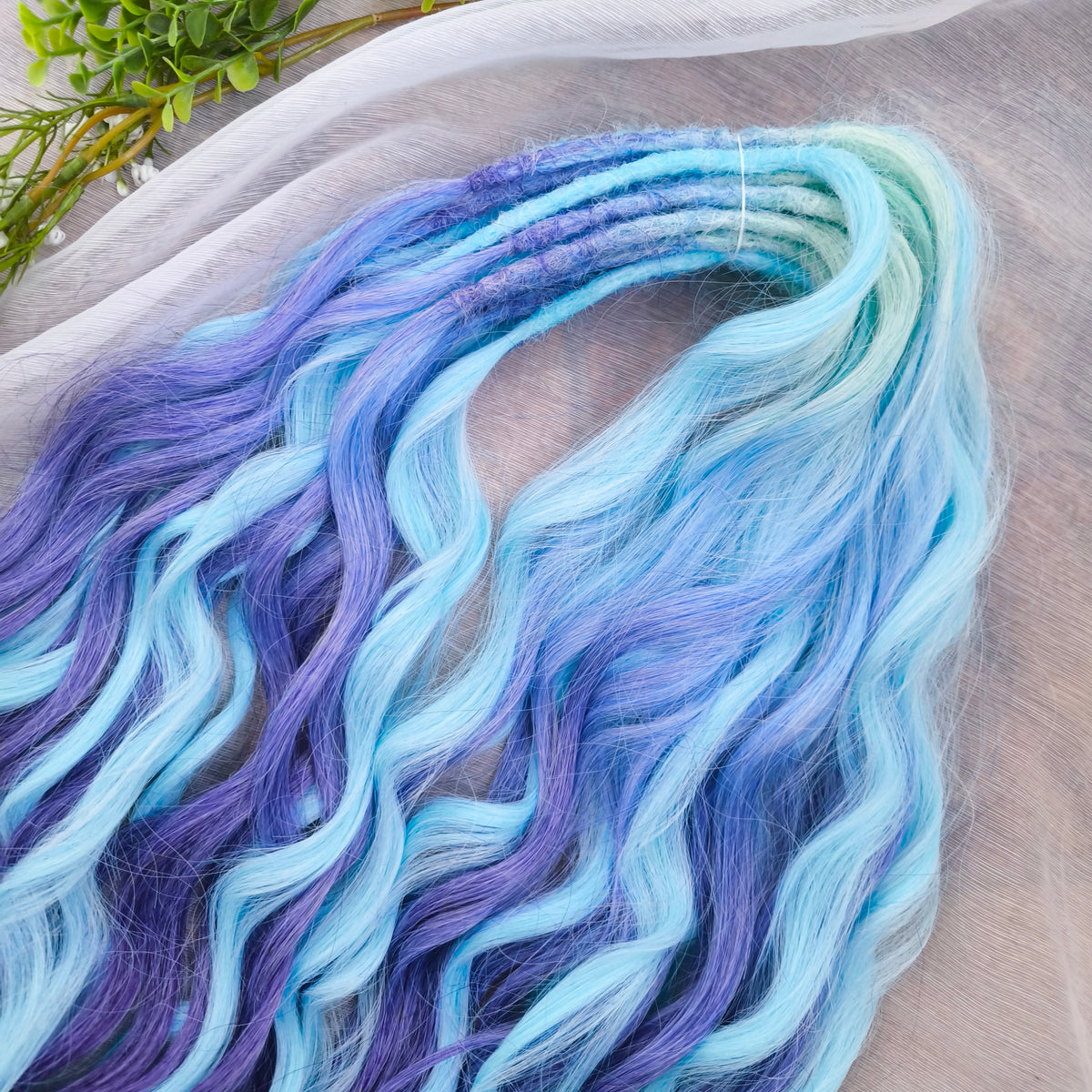 Blue Iris - soft, lightweight, and reusable; this set combines purple, cool blue, and deep navy brushable, synthetic double ended wavy dreadlocks.
