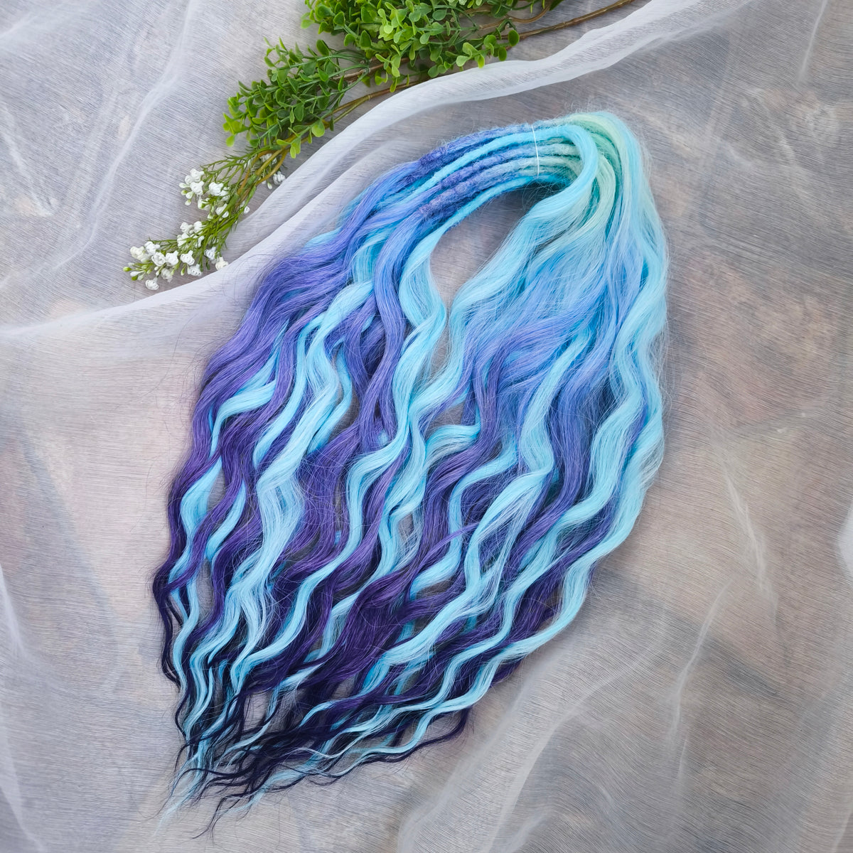 Blue Iris - soft, lightweight, and reusable; this set combines purple, cool blue, and deep navy brushable, synthetic double ended wavy dreadlocks.