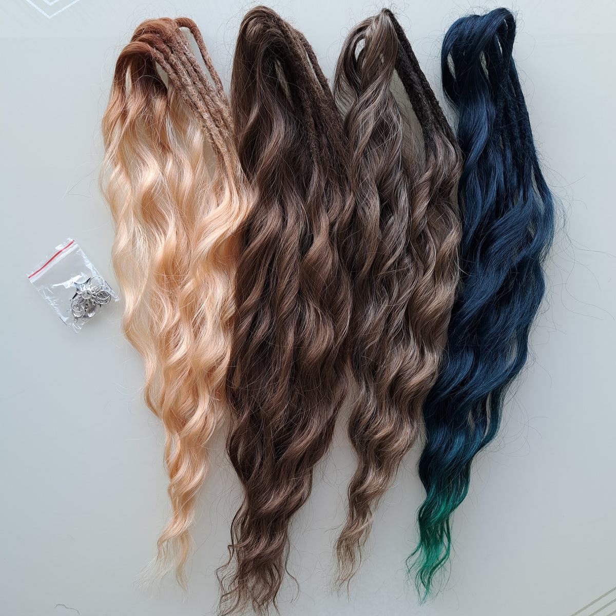 Sylvan - double ended warm brown, golden blonde, midnight teal synthetic brushable wavy dreadlocks. Soft, lightweight, and reusable, woodland-inspired blend with a touch of dark, mysterious magic.