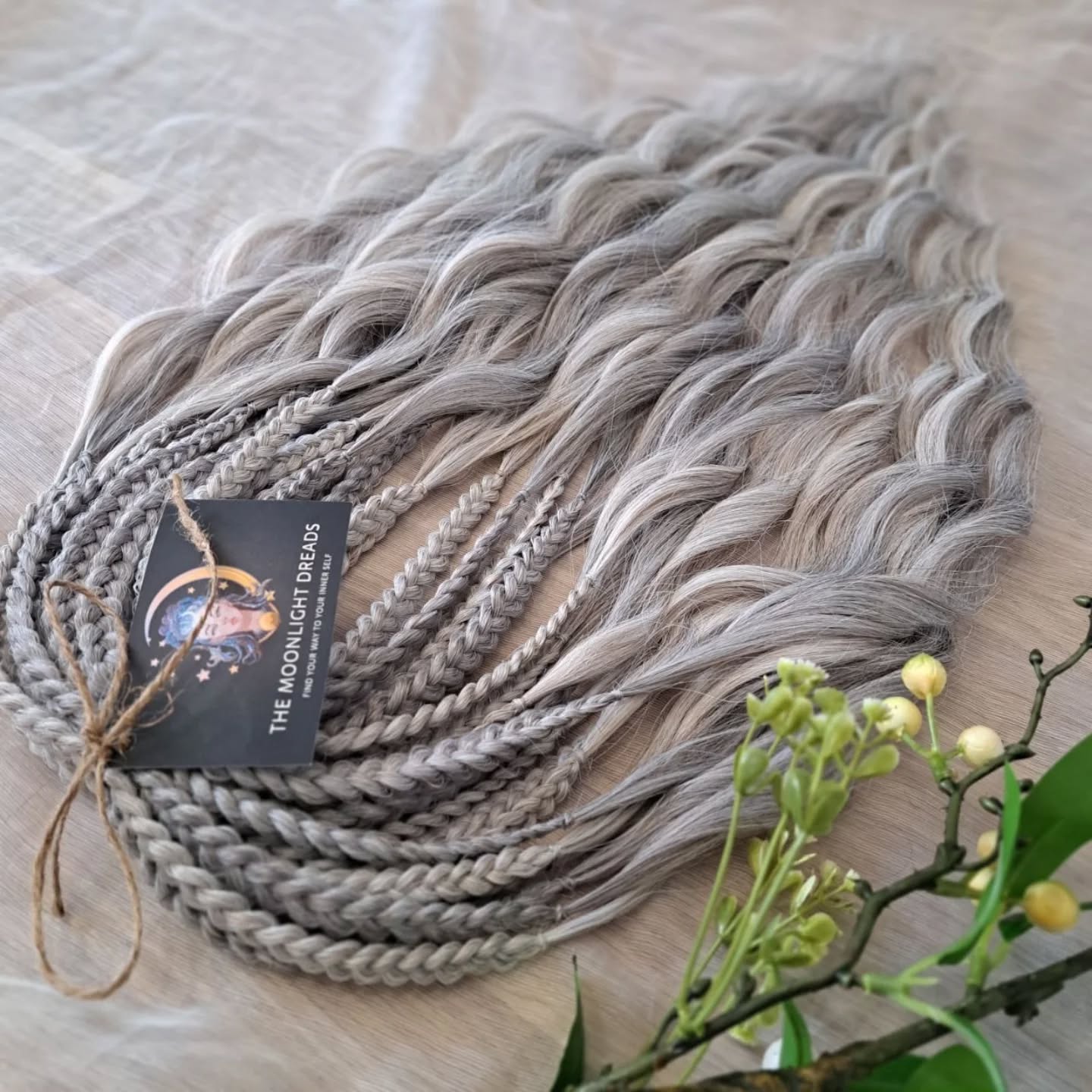 Soft, lightweight, and reusable synthetic brushable double ended wavy dreadlocks (regular dreaded, braided middle, or push-up) in 2 shades of gray.