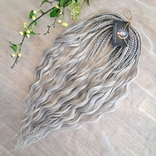 Soft, lightweight, and reusable synthetic brushable double ended wavy dreadlocks (regular dreaded, braided middle, or push-up) in 2 shades of gray.