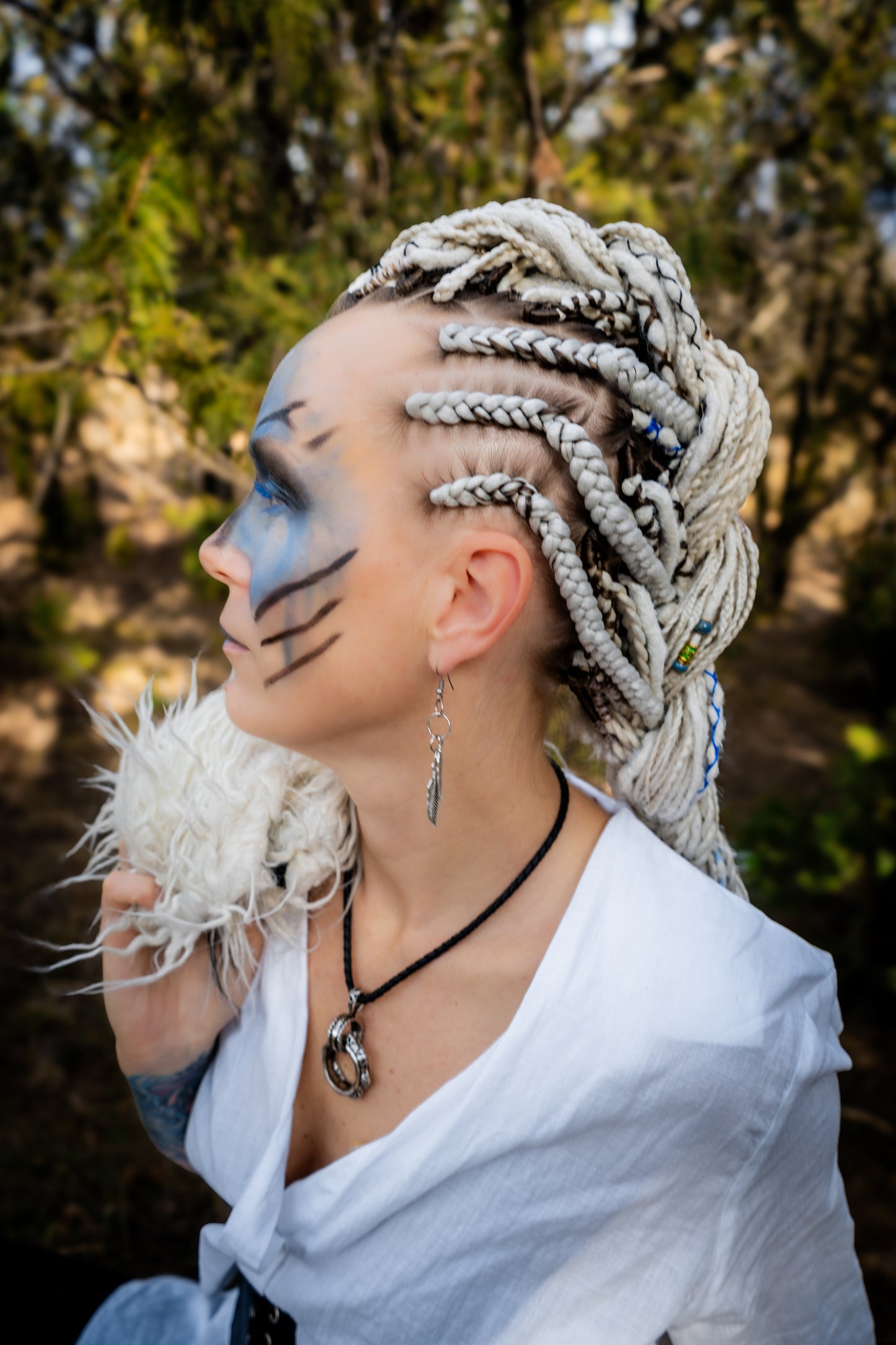 This set of synthetic dreadlocks combines elements of a Viking-inspired aesthetic.
Scandinavian blonde double ended crochet bumpy dreads, braids, and Senegalese twists. Decoration is included. Reusable lightweight set made from high-quality synthetic hypoallergenic material kanekalon.

Standard length: ±22-24 inches (55-60 cm)
Thickness of dreads and braids: ±0.8 cm