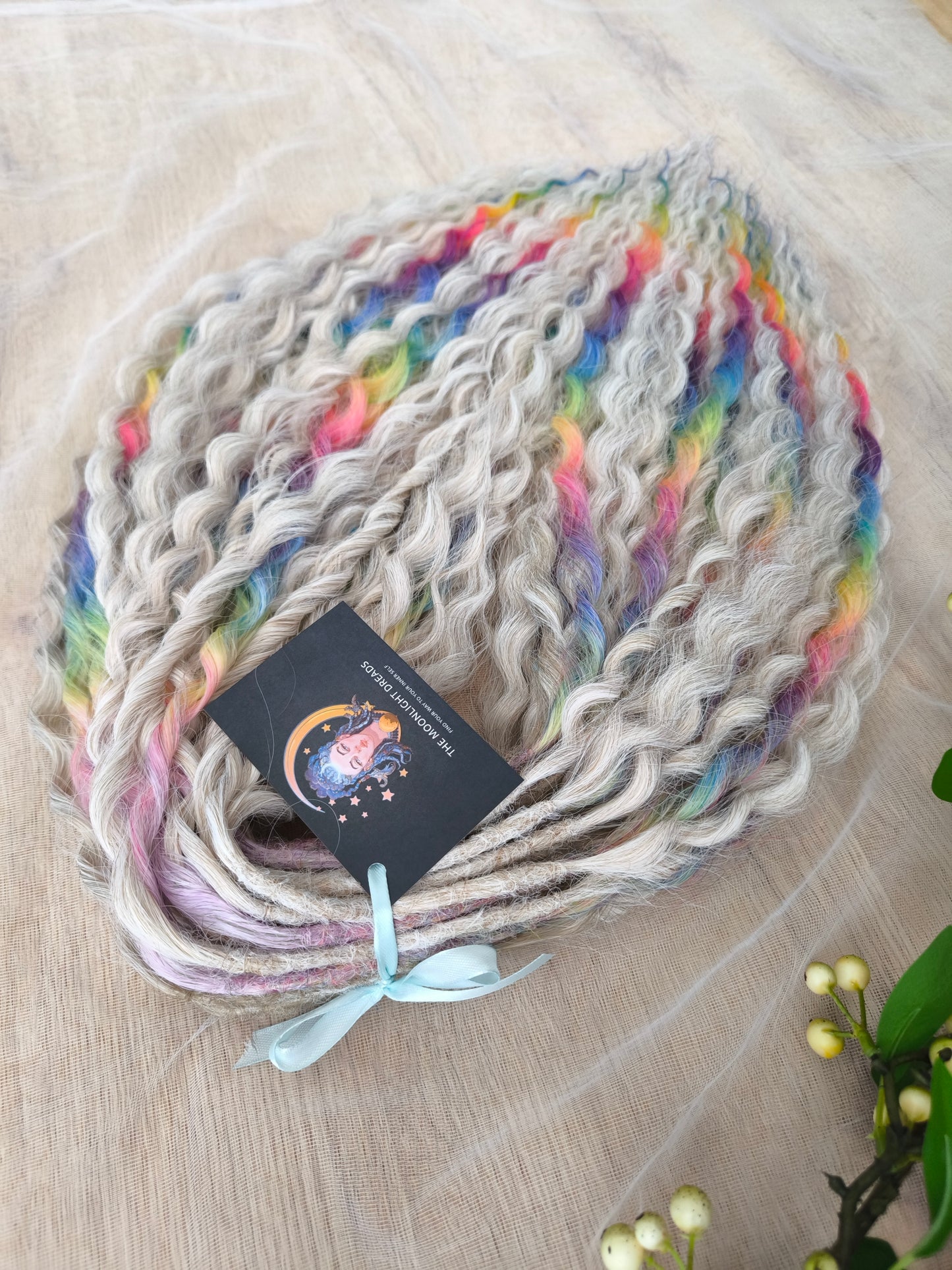 White Rainbow: the mix of Platinum Blonde (2/3 parts of blonde) + and Rainbow/glitch/prism effect (1/3 part of rainbow) soft, lightweight, and reusable synthetic brushable double ended wavy dreadlocks (NOT BRUSHABLE).