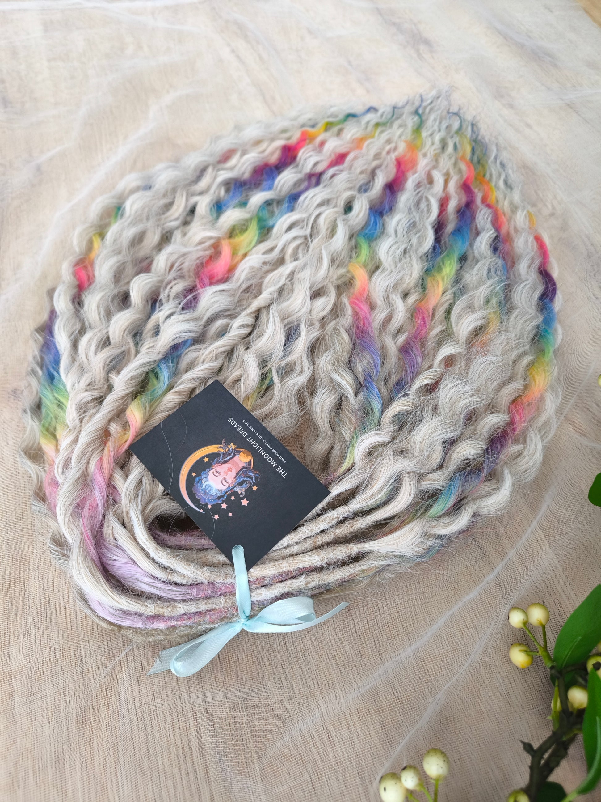 White Rainbow: the mix of Platinum Blonde (2/3 parts of blonde) + and Rainbow/glitch/prism effect (1/3 part of rainbow) soft, lightweight, and reusable synthetic brushable double ended wavy dreadlocks (NOT BRUSHABLE).