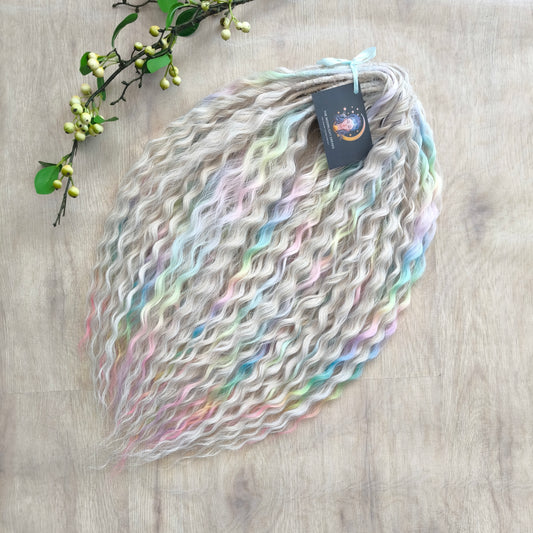 Pastel Unicorn: the mix of Platinum Blonde (2/3 parts of blonde) + and Pastel Rainbow/glitch/prism effect (1/3 part of rainbow) soft, lightweight, and reusable synthetic brushable double ended wavy dreadlocks (NOT BRUSHABLE)