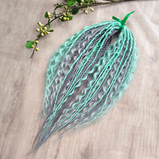 Mix of silver grey and mint green synthetic partial set of 34 double ended dreads, braids, dreaded curls.