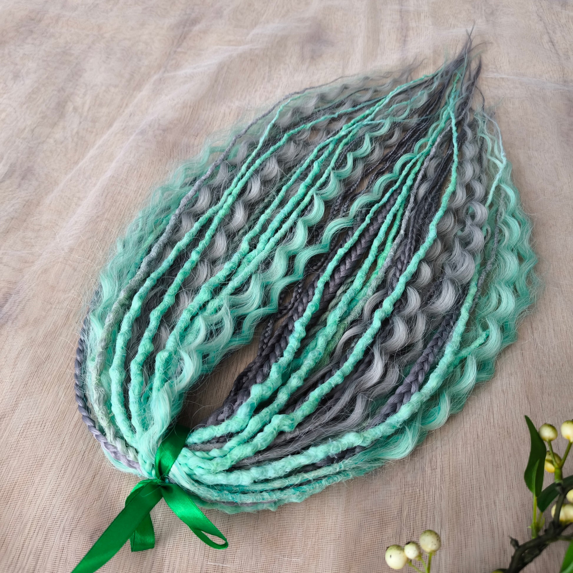 Mix of silver grey and mint green synthetic partial set of 34 double ended dreads, braids, dreaded curls.