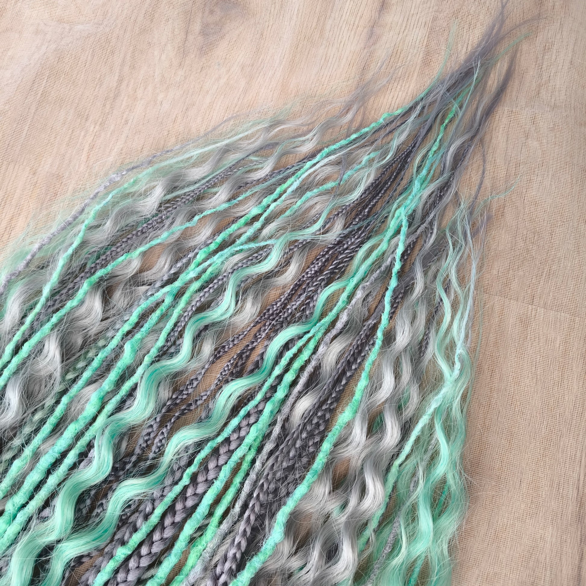 Mix of silver grey and mint green synthetic partial set of 34 double ended dreads, braids, dreaded curls.