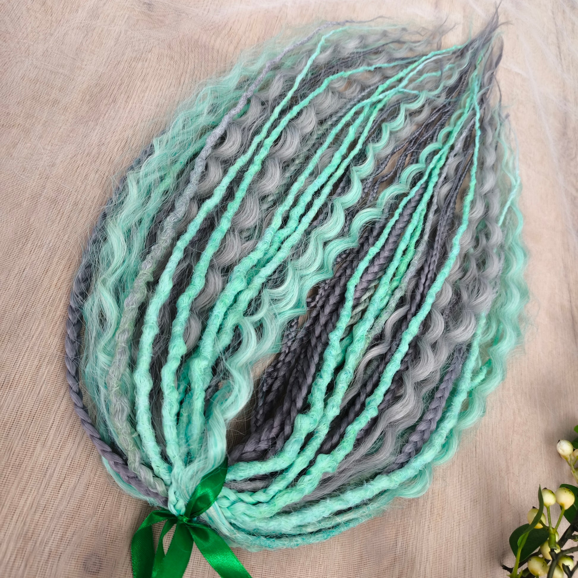 Mix of silver grey and mint green synthetic partial set of 34 double ended dreads, braids, dreaded curls.