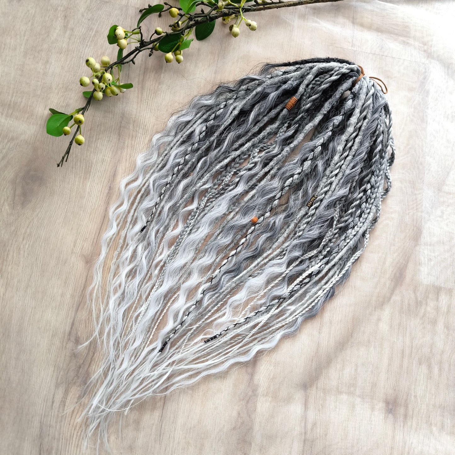 This set of synthetic dreadlocks combines elements of a Viking-inspired aesthetic.
Ombre from grey to platinum blonde double ended crochet dreads, braids, and Senegalese twists (curls optionally). Decoration is included. Reusable lightweight set made from high-quality synthetic hypoallergenic material kanekalon.

Standard length: ±22-24 inches (55-60 cm)
Thickness of dreads and braids: ±0.8 cm
Dreaded part of curls: ±3-4 inches (8-10 cm)