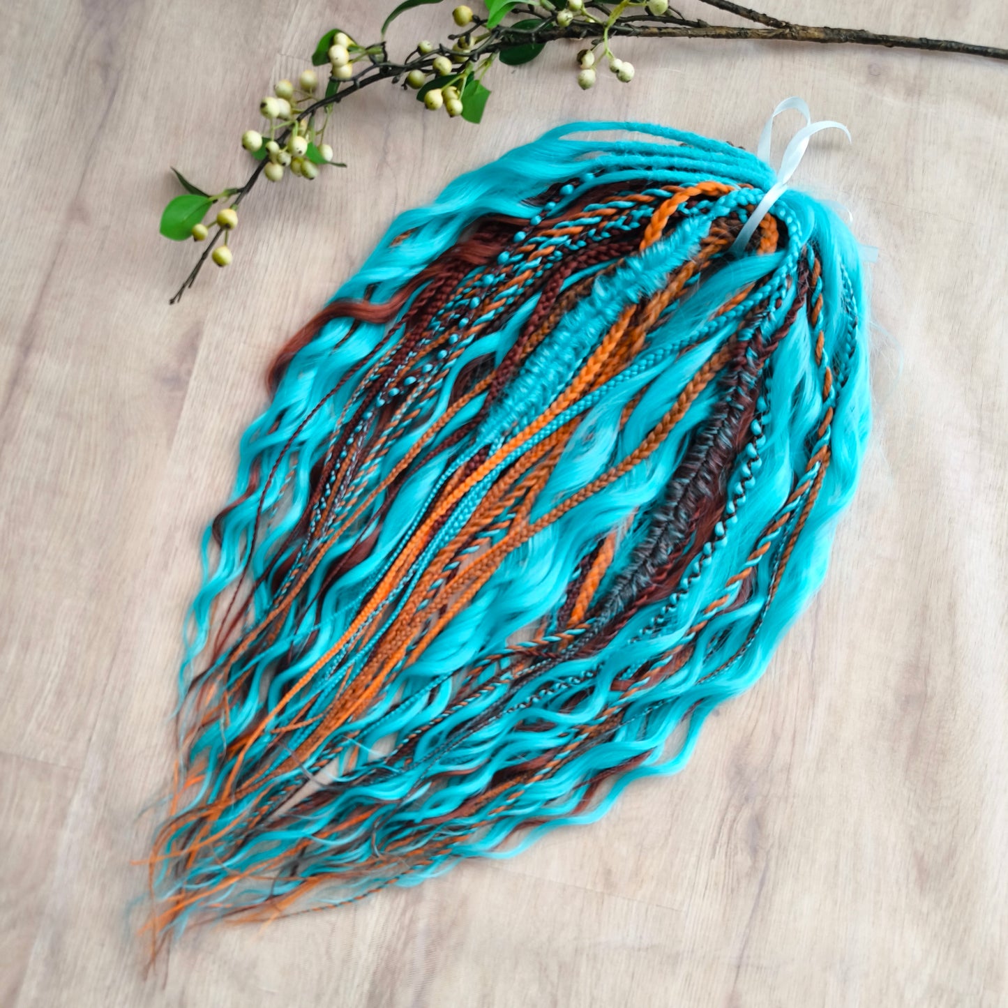 Ginger Sky: soft, lightweight, and reusable double ended various DE synthetic braids and regular dreaded brushable curls. A mix of turquoise green, red, copper, and orange colors.

The length is 22-24 inches (55-60 cm)
Dreaded part of curls: 4-5 inches
Thickness of braids ±0.8 cm