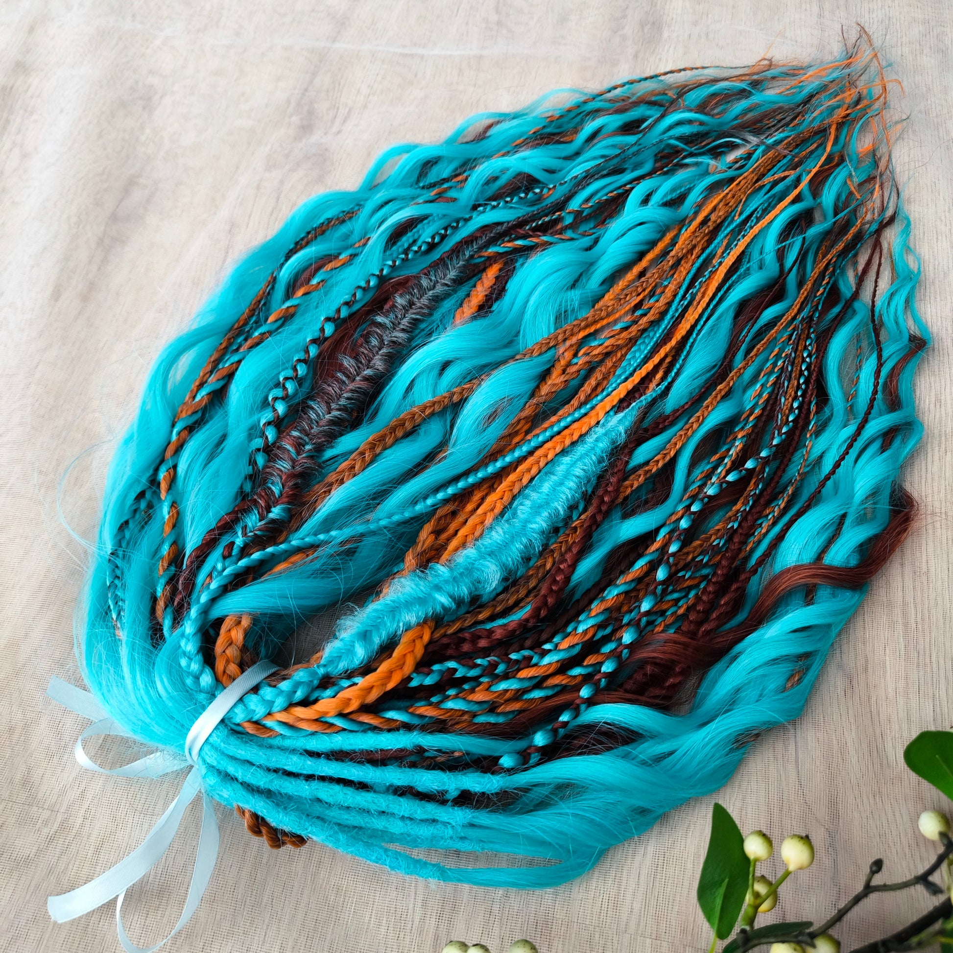 Ginger Sky: soft, lightweight, and reusable double ended various DE synthetic braids and regular dreaded brushable curls. A mix of turquoise green, red, copper, and orange colors.

The length is 22-24 inches (55-60 cm)
Dreaded part of curls: 4-5 inches
Thickness of braids ±0.8 cm