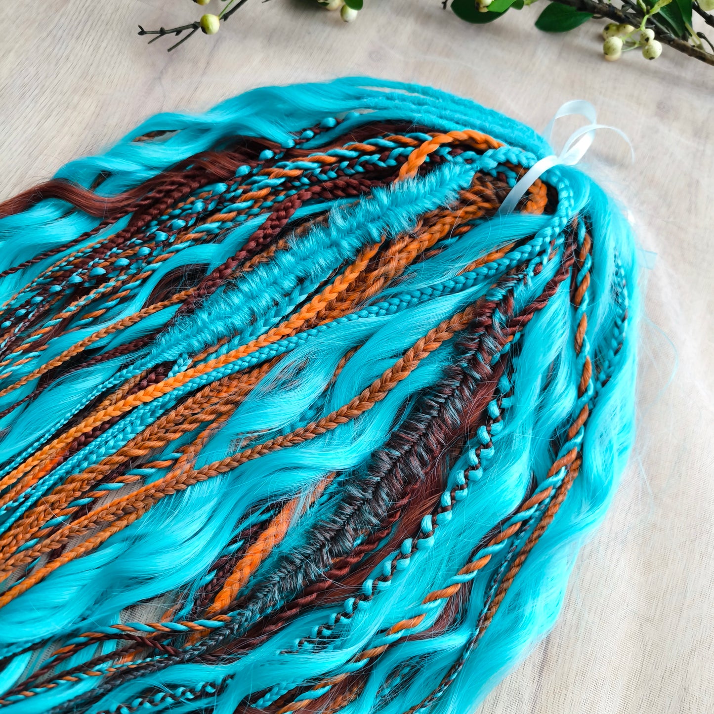 Ginger Sky: soft, lightweight, and reusable double ended various DE synthetic braids and regular dreaded brushable curls. A mix of turquoise green, red, copper, and orange colors.

The length is 22-24 inches (55-60 cm)
Dreaded part of curls: 4-5 inches
Thickness of braids ±0.8 cm