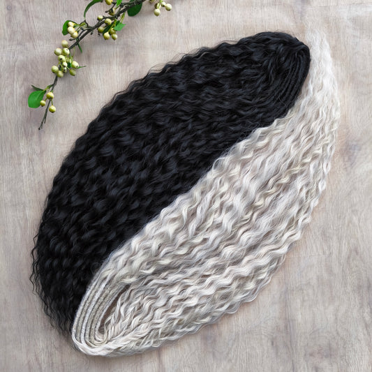 Black and white/blonde set of 62 double ended synthetic non-brushable dreaded curls.

Length: ±28-30 inches (70-75 cm)
Dreaded part of curls ±3-4 inches (8-10 cm)
Weight: ±420 gr (15 oz)