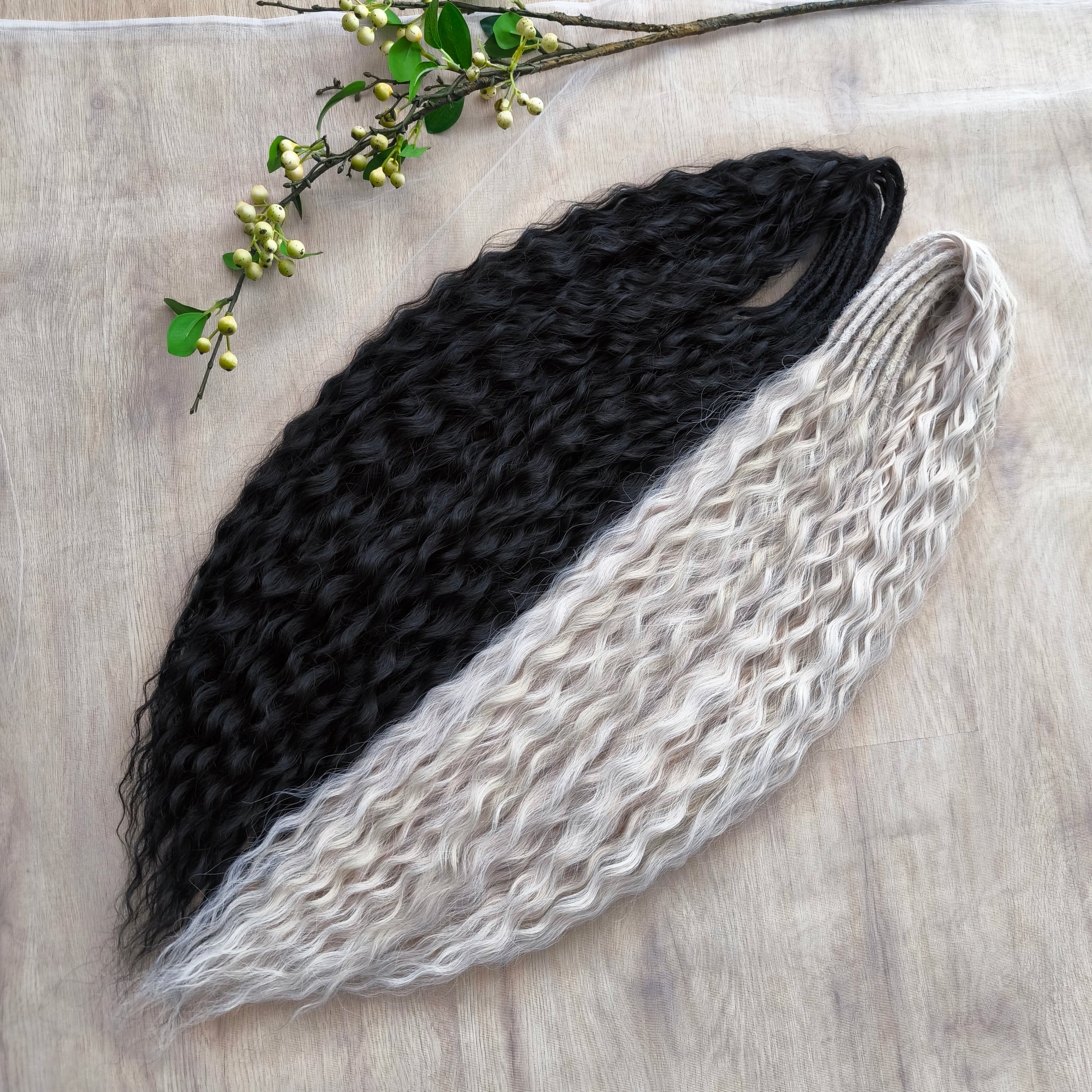 Black and white/blonde set of 62 double ended synthetic non-brushable dreaded curls.

Length: ±28-30 inches (70-75 cm)
Dreaded part of curls ±3-4 inches (8-10 cm)
Weight: ±420 gr (15 oz)