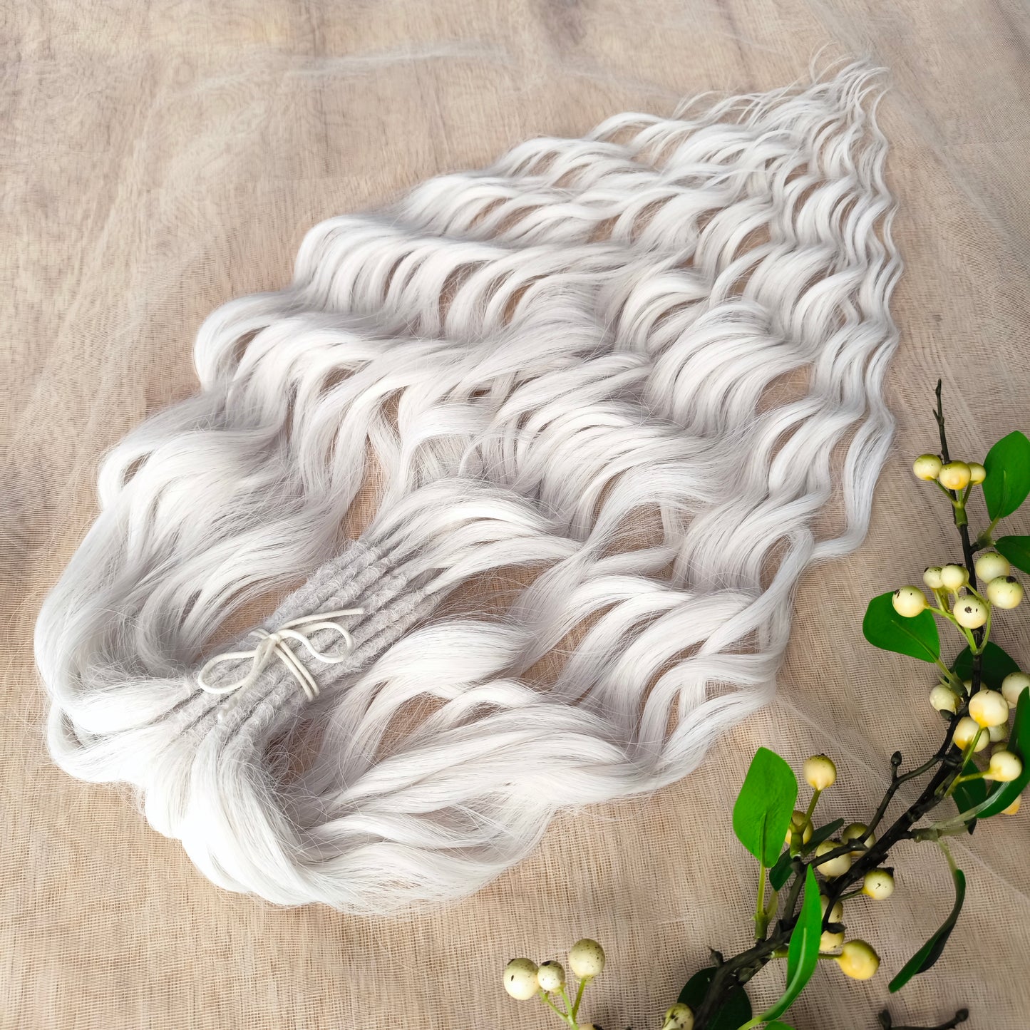 Snow-white soft, lightweight, and reusable synthetic brushable double ended wavy dreadlocks (regular dreaded, braided middle, or push-up). 