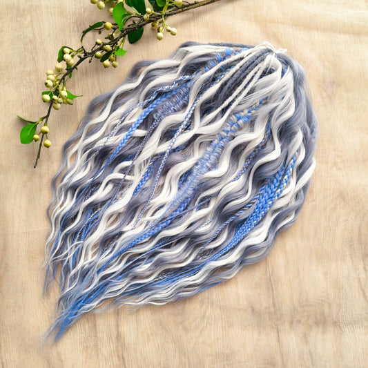 Arctic Ice: soft, lightweight, and reusable 60 double ended various synthetic braids, Senegalese twists, and brushable regular dreaded curls. A mix of white, sky blue and steel blue colours.

The length is 22-24 inches (55-60 cm)
Dreaded part of curls: 3-4 inches (8-10 cm)
Thickness of braids ±0.8 cm