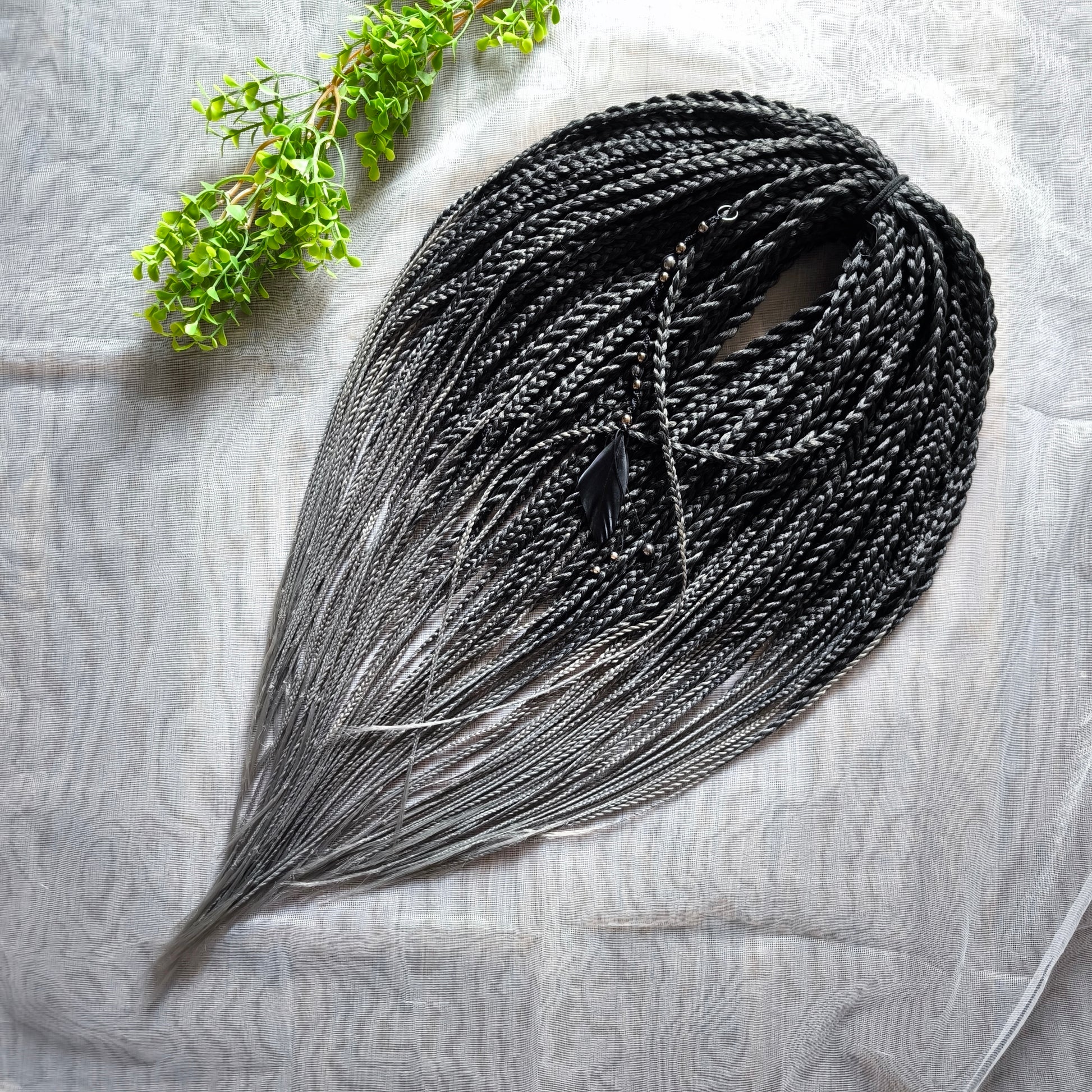 The set of 57 double ended synthetic braids and Senegalese twists ombre from black to grey "Graffit"

Standard length: 22-24 inches (55-60 cm)
Thickness of braids: ~0.8-1 cm