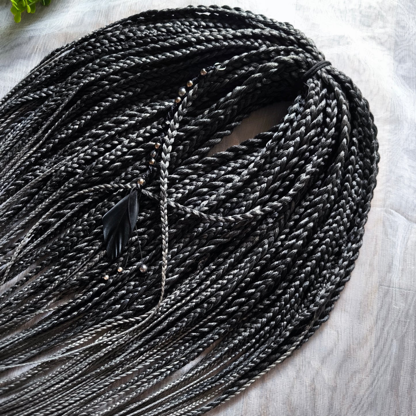 The set of 57 double ended synthetic braids and Senegalese twists ombre from black to grey "Graffit"

Standard length: 22-24 inches (55-60 cm)
Thickness of braids: ~0.8-1 cm