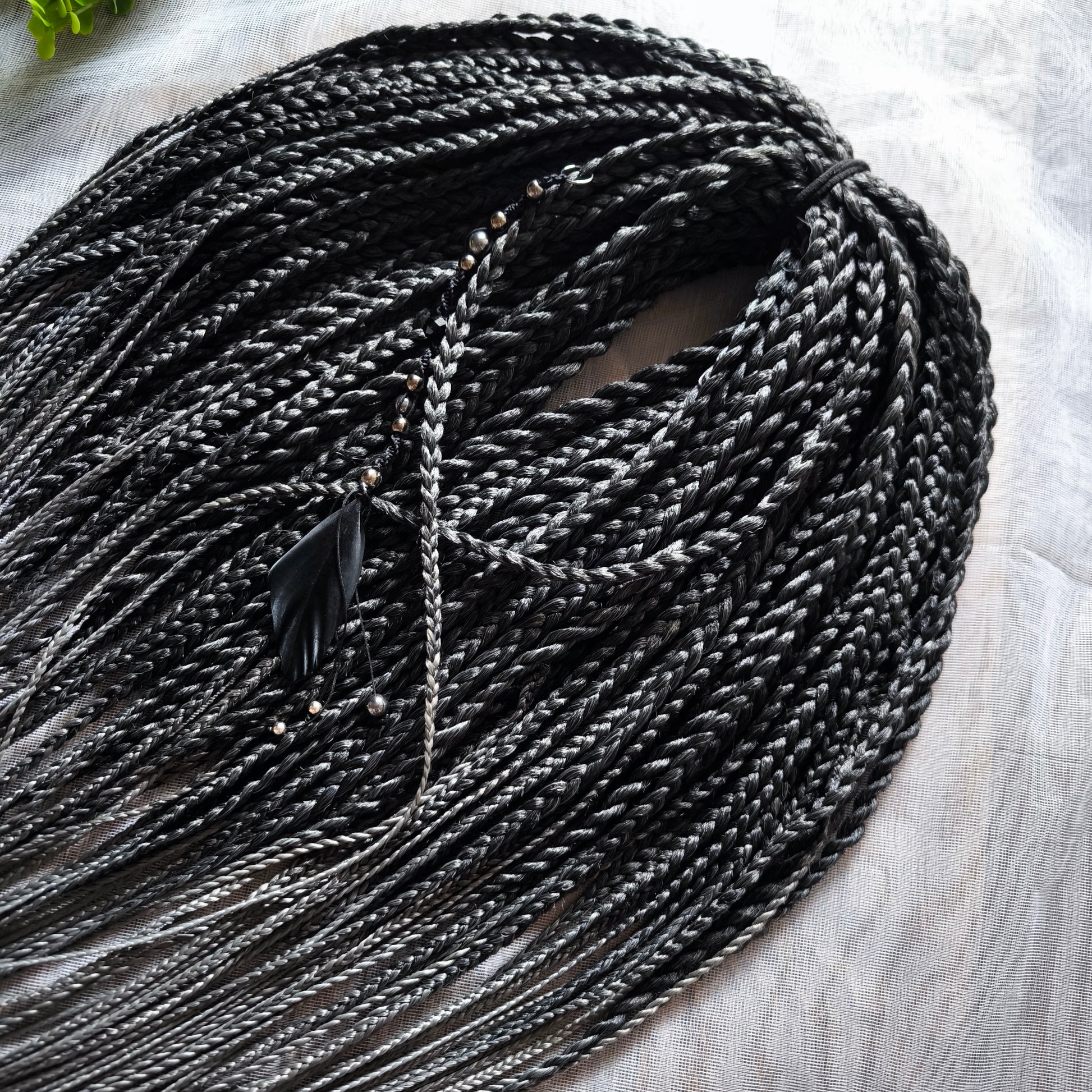 The set of 57 double ended synthetic braids and Senegalese twists ombre from black to grey "Graffit"

Standard length: 22-24 inches (55-60 cm)
Thickness of braids: ~0.8-1 cm