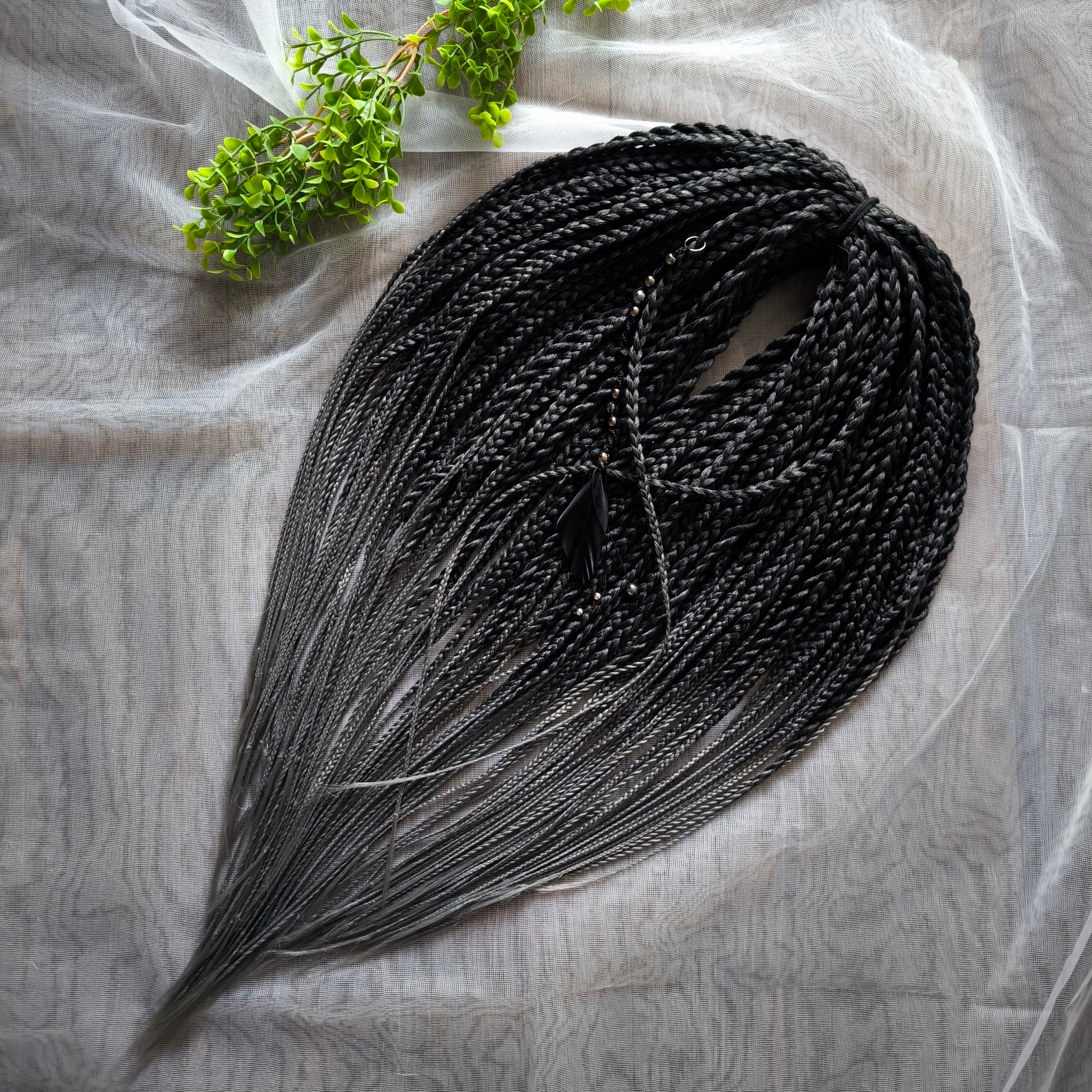 The set of 57 double ended synthetic braids and Senegalese twists ombre from black to grey "Graffit"

Standard length: 22-24 inches (55-60 cm)
Thickness of braids: ~0.8-1 cm