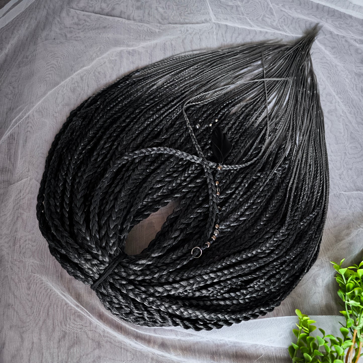The set of 57 double ended synthetic braids and Senegalese twists ombre from black to grey "Graffit"

Standard length: 22-24 inches (55-60 cm)
Thickness of braids: ~0.8-1 cm