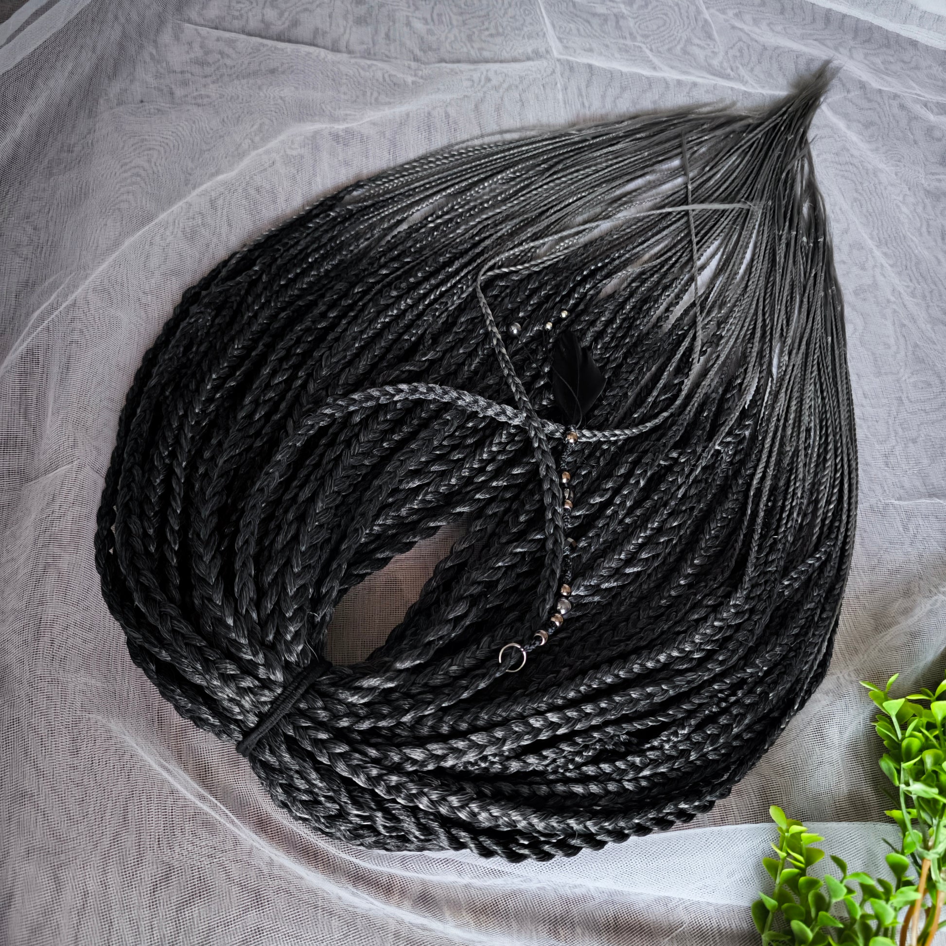 The set of 57 double ended synthetic braids and Senegalese twists ombre from black to grey "Graffit"

Standard length: 22-24 inches (55-60 cm)
Thickness of braids: ~0.8-1 cm