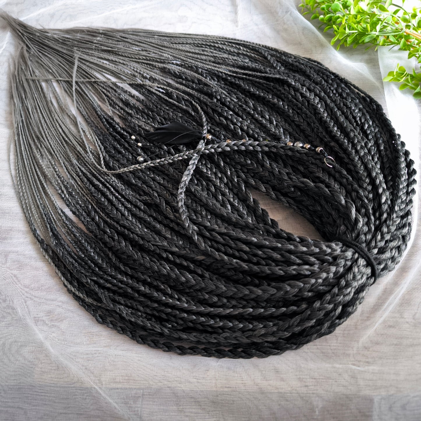 The set of 57 double ended synthetic braids and Senegalese twists ombre from black to grey "Graffit"

Standard length: 22-24 inches (55-60 cm)
Thickness of braids: ~0.8-1 cm