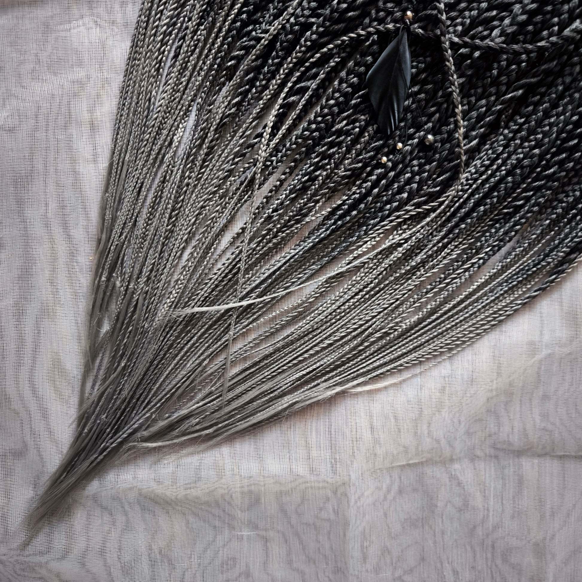 The set of 57 double ended synthetic braids and Senegalese twists ombre from black to grey "Graffit"

Standard length: 22-24 inches (55-60 cm)
Thickness of braids: ~0.8-1 cm
