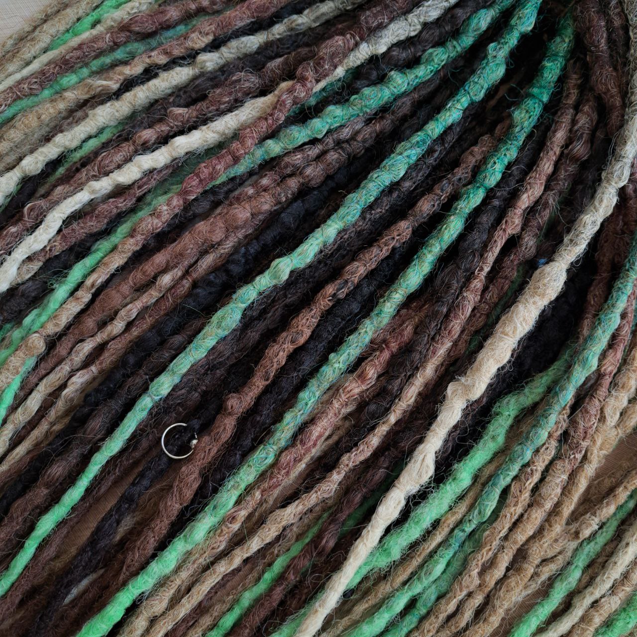 Forest Spirit - textured crochet dreads capture the calm, grounding energy of nature. The mix of moss green, chestnut brown, and sandy beige creates a rich, organic palette that feels both wild and soothing. This set brings a forest-inspired balance — warm earth tones with a hint of fresh green life. 