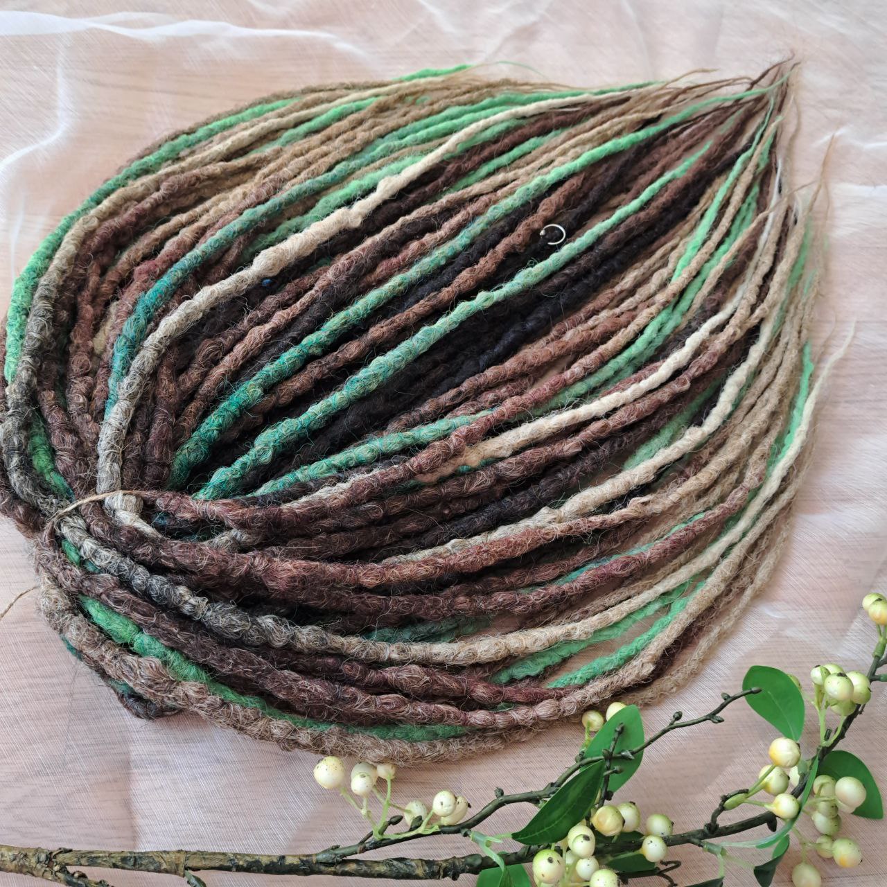 Forest Spirit - textured crochet dreads capture the calm, grounding energy of nature. The mix of moss green, chestnut brown, and sandy beige creates a rich, organic palette that feels both wild and soothing. This set brings a forest-inspired balance — warm earth tones with a hint of fresh green life. 