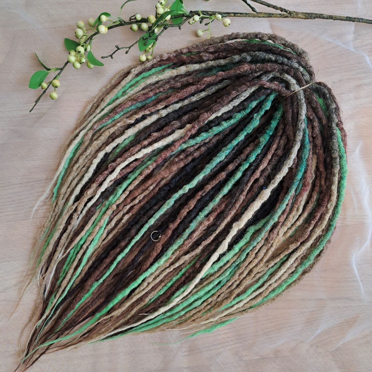 Forest Spirit - textured crochet dreads capture the calm, grounding energy of nature. The mix of moss green, chestnut brown, and sandy beige creates a rich, organic palette that feels both wild and soothing. This set brings a forest-inspired balance — warm earth tones with a hint of fresh green life. 